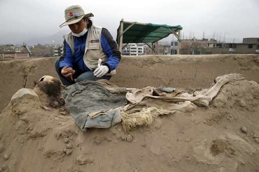 Click to enlarge Archeologists work at the site where 16 tombs belonging to 19th century Chinese immigrants were discovered