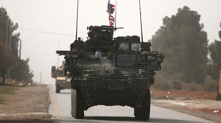U.S. army vehicles drive north of Manbij city