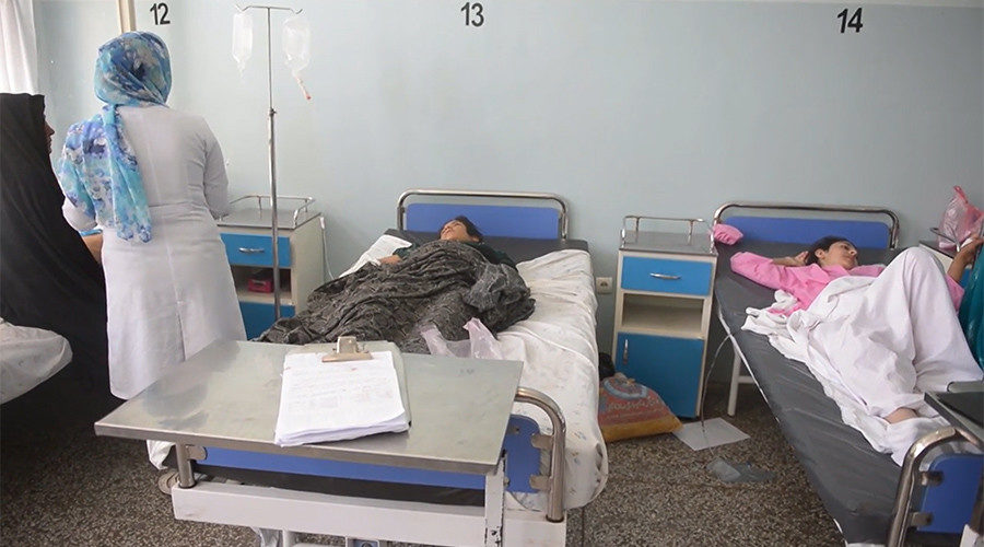 Click to enlarge Injured Afghans in hospital