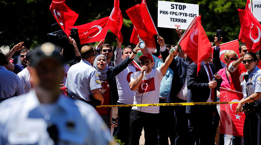group of pro-Erdogan demonstrators shout slogans at a group of anti-Erdogan Kurds