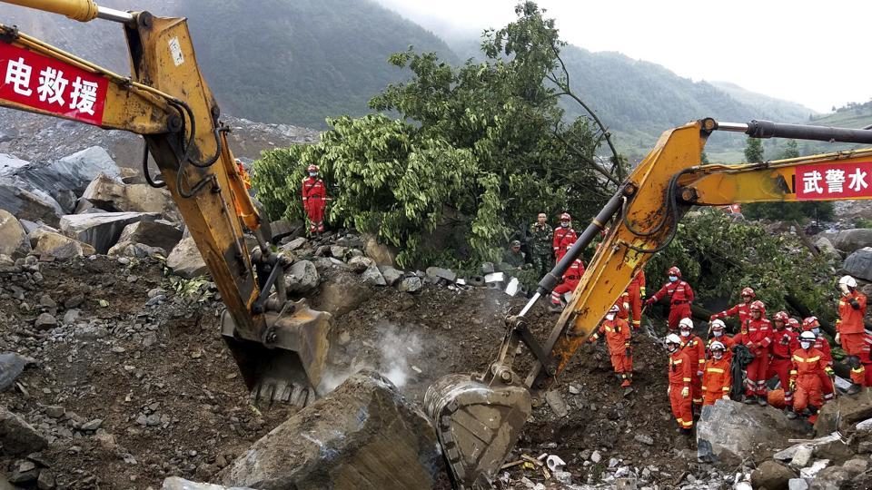 Rescuers work at the site of a landslide in Nayong county in southwest China's Guizhou province, Tuesday, Aug. 29, 2017