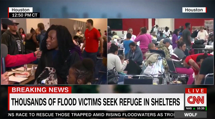 CNN reporter interviewing flood survivor