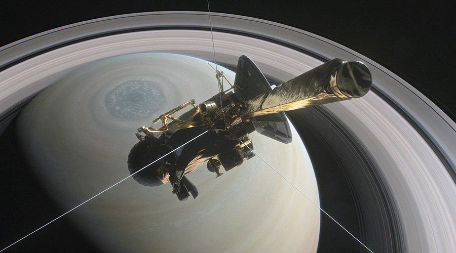 Cassini is pictured above Saturn