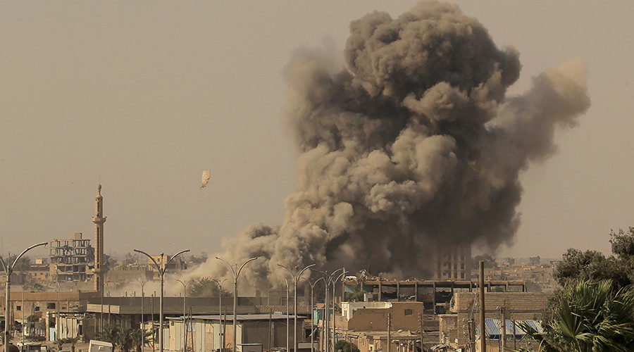 Smoke rises after an air strike in Raqqa, Syria