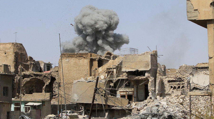 Smoke rises from an air strike in the Old City of Mosul