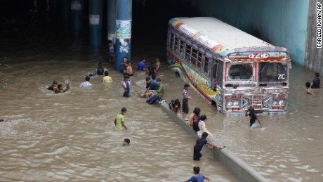 Click to enlarge Pakistani children play in an underpass filled with rainwater in Karachi, Pakistan, Thursday, Aug. 31, 2017