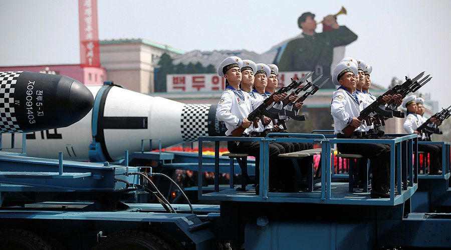 Click to enlarge Military vehicles carry missiles