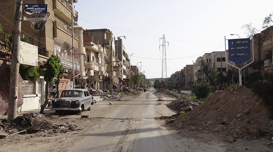 A view of a damaged street in Deir al-Zor, eastern Syria
