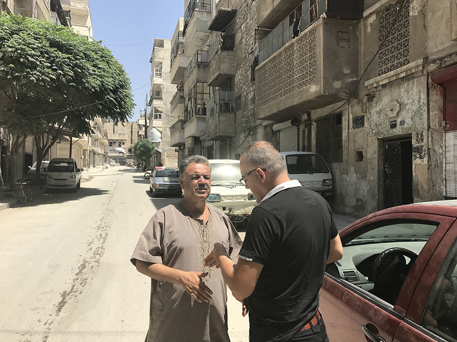 Meeting Abu Omar outside his home in East Aleppo with journalist Khaled Iskef