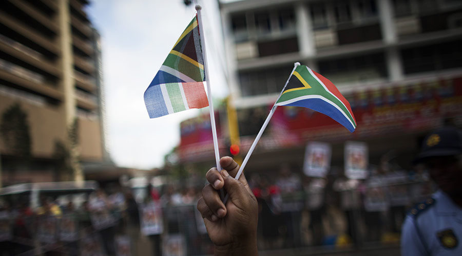 Person holding South African flags