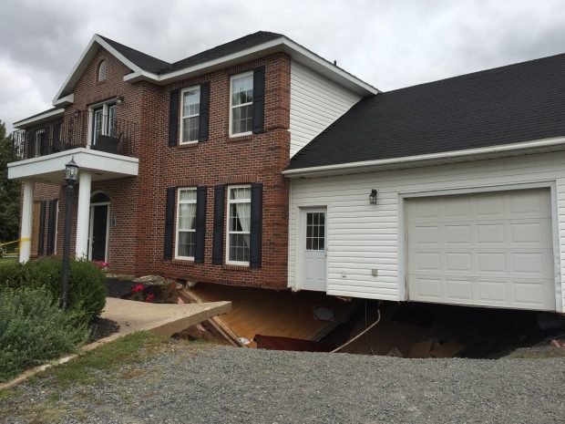 The bottom of this house in Falmouth fell victim to a sinkhole on Sunday