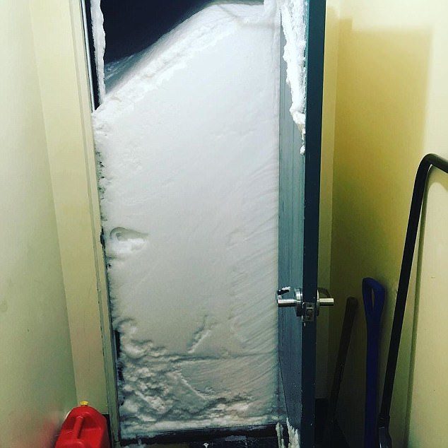 Click to enlarge A massive dump of snow led to one home being 'snowed in', with this incredible photo showing the severity of the snowfall