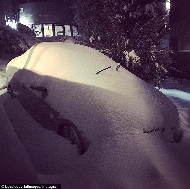 Click to enlarge The record levels of falls in some areas led to cars being completely covered in the thick snow