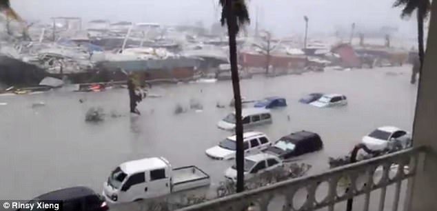 Click to enlarge Social media videos show how the hurricane lashed the coastline of Saint Martin overnight with cars submerged in water. This picture is believed to have been taken at the Beach Plaza hotel on the island