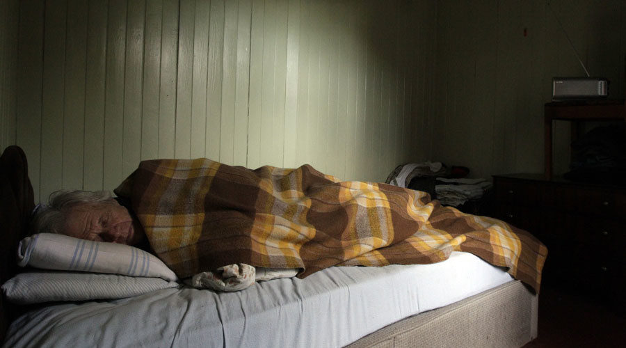 old man sleeping poverty
