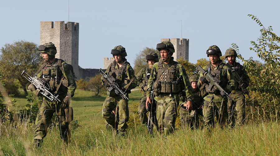 Click to enlarge Swedish military patrol outside Visby, island of Gotland, Sweden