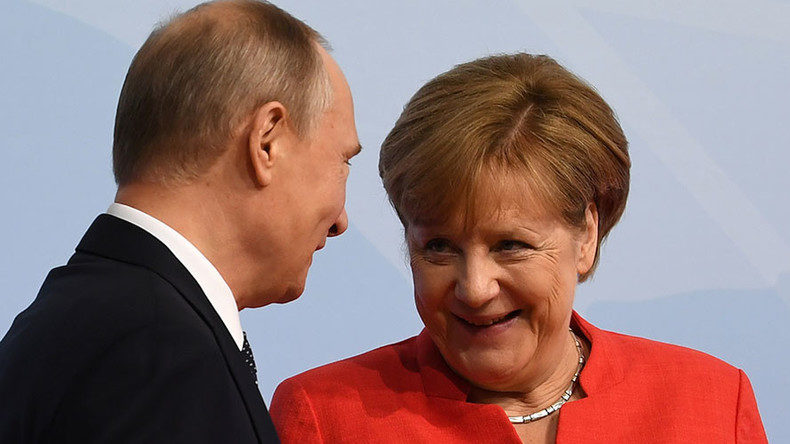 Vladimir Putin and Angela Merkel