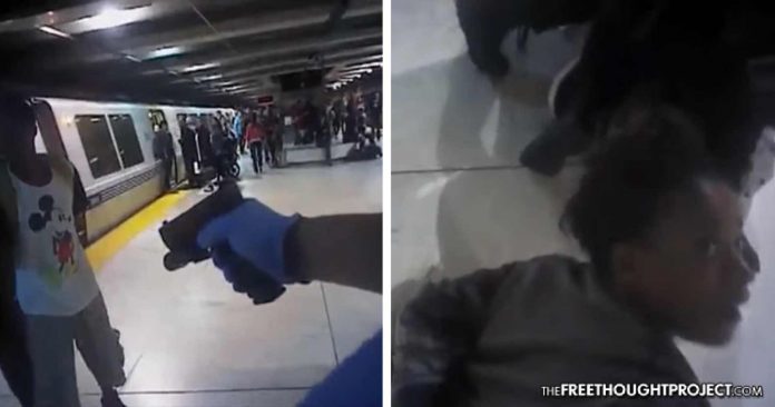 Bay Area Transit Police pinning a woman down