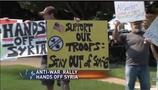 Author holding up sign