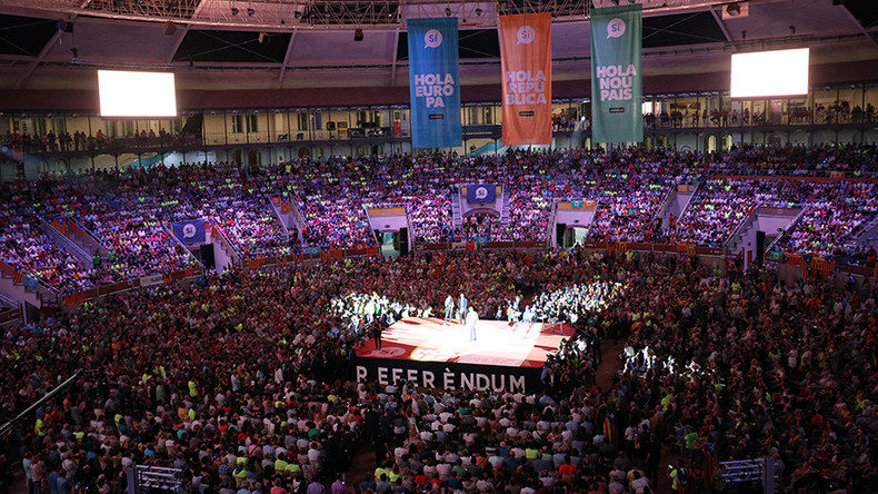 People attend a Catalan pro-independence meeting