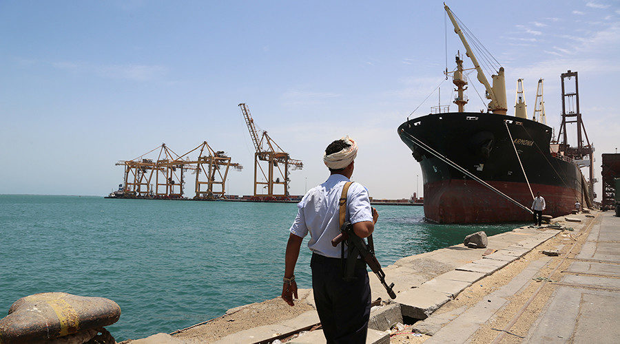 Click to enlarge A soldier walks at Red Sea port of Hodeidah, Yemen