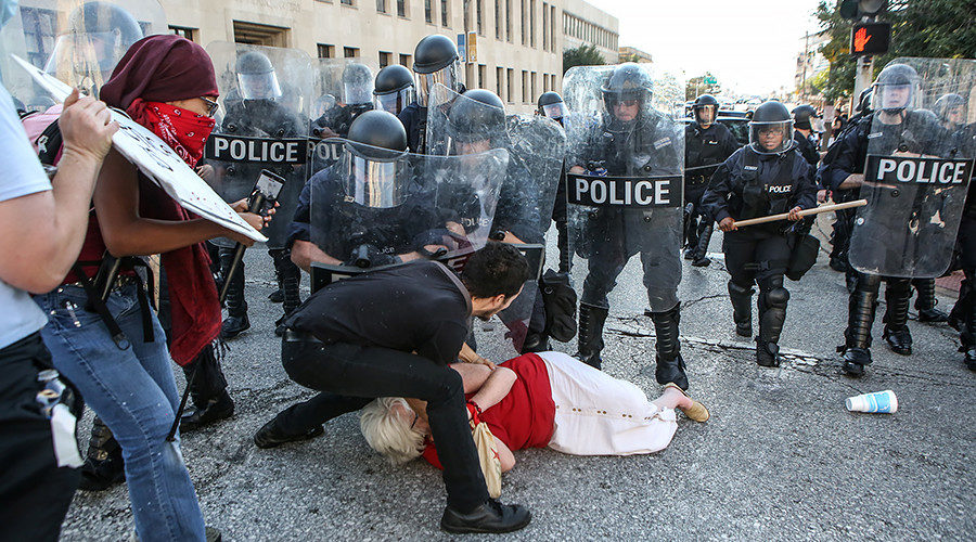 Older woman knocked to ground during protest