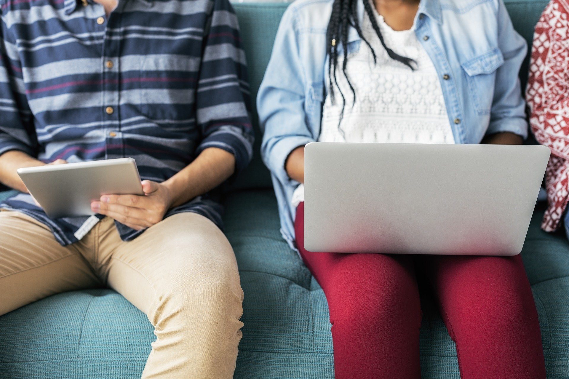 Teenagers using digital devices.