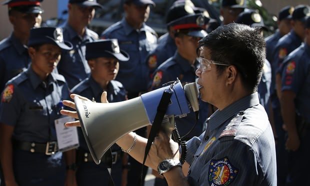 Trainee officers being briefed outside Caloocan city police