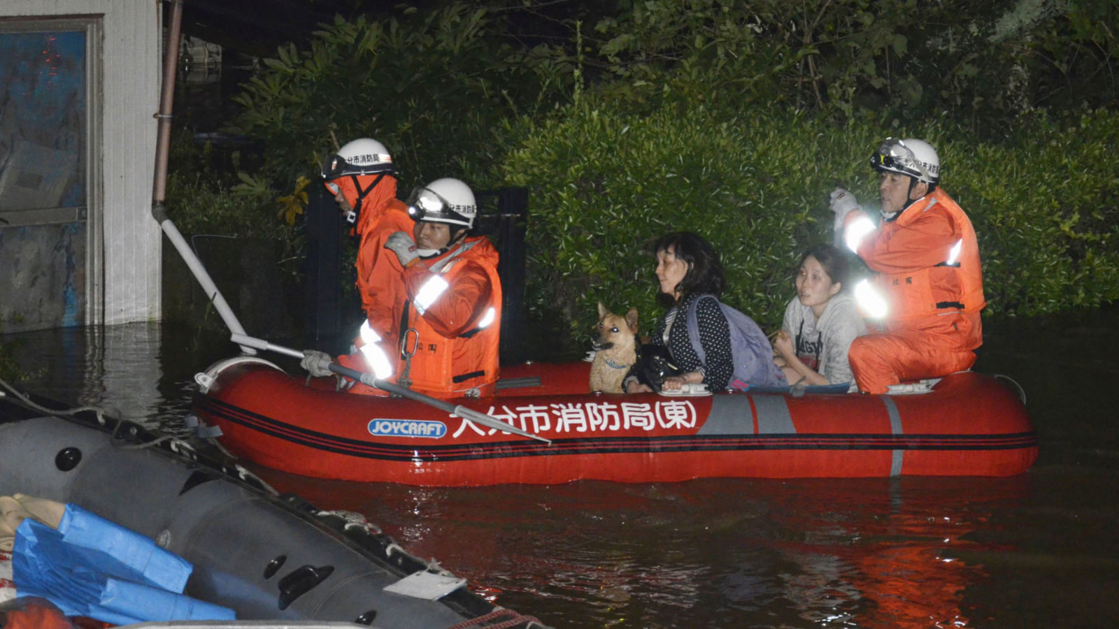 Residents are evacuated from their home in Oita, Japan after heavy rainfall