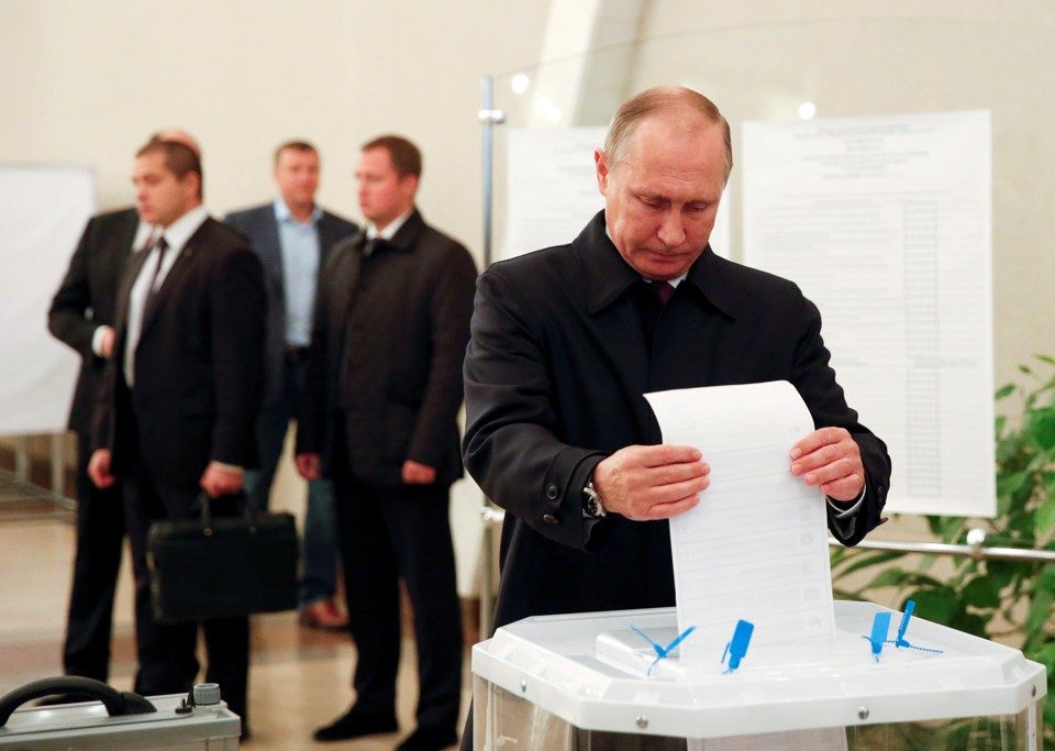 Putin casts his ballot at a polling station during a parliamentary election in Moscow, Russia, September 18, 2016
