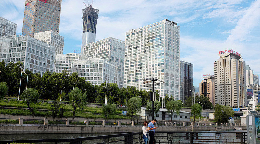 People rest at a park near Beijing's central business area