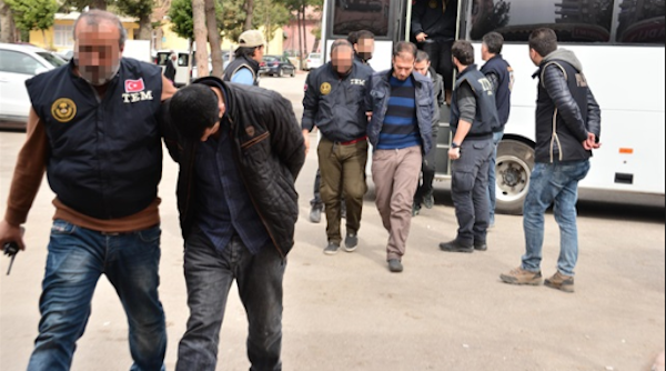 Turkish security forces escort detained suspects