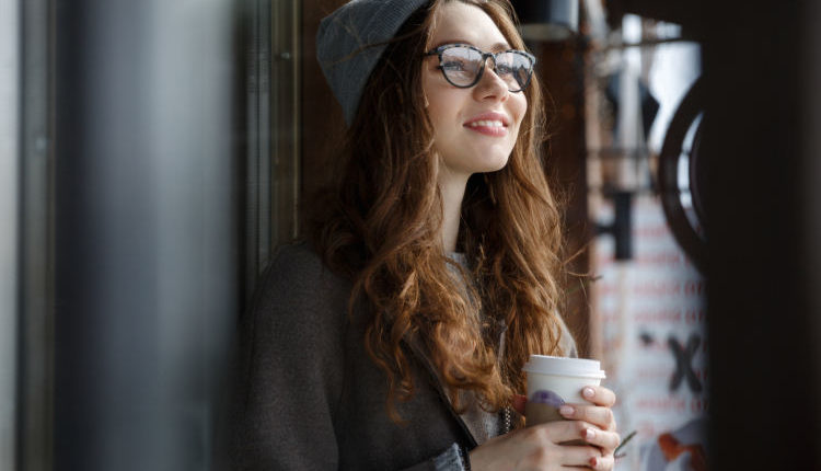 young girl drinks coffee