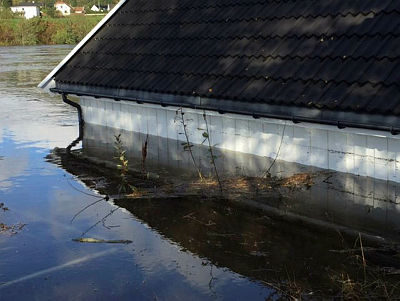 One of the many buildings innundated by flooding along the Otra River near Mosby, just north of Kristiansand.