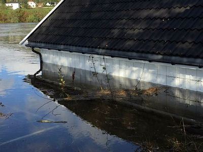 Click to enlarge One of the many buildings innundated by flooding along the Otra River near Mosby, just north of Kristiansand.