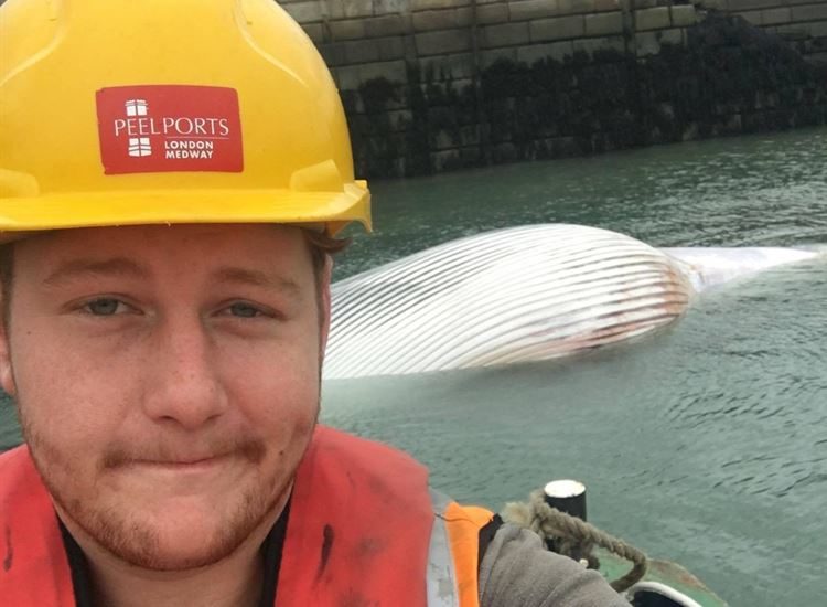 Jack Smedley and the whale carcass he and his crew brought into Sheerness docks