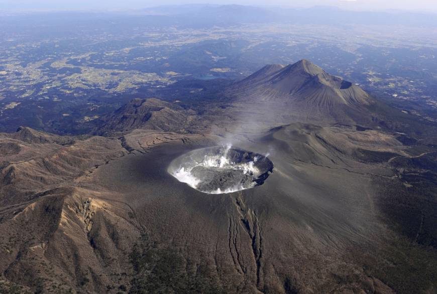 Shinmoedake peak in the Kirishima mountain range on the border of Kagoshima and Miyazaki prefectures is seen in a 2012 file photo.