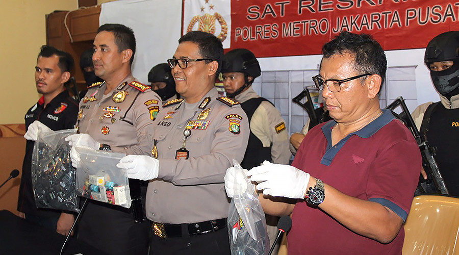 Police officers displaying evidence
