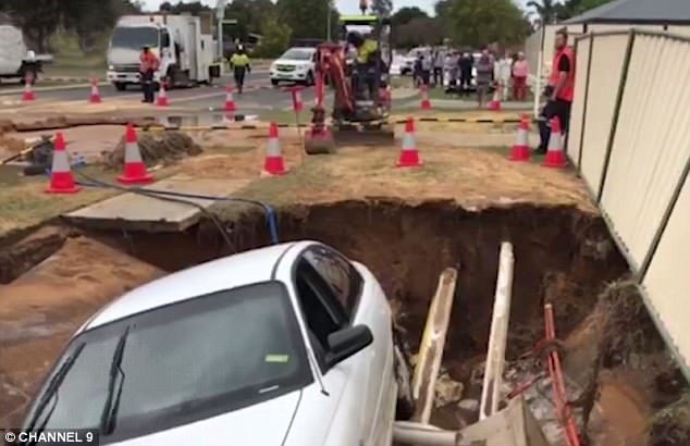 A sinkhole has swallowed cars and caused major traffic delays in Perth