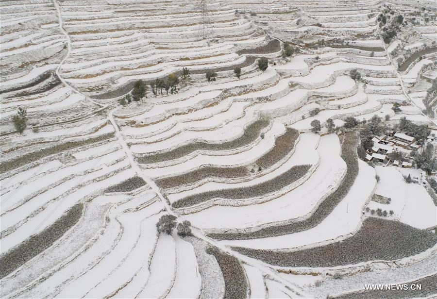 Click to enlarge Aerial photo taken on Oct. 10, 2017 shows snow scenery in Qinglanshan Township of Dingxi City, northwest China's Gansu