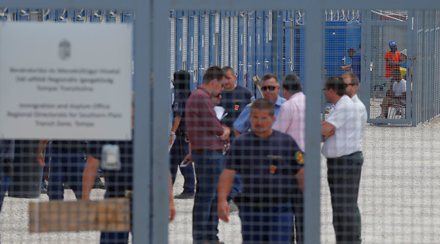 Migrants wait in the transit zone