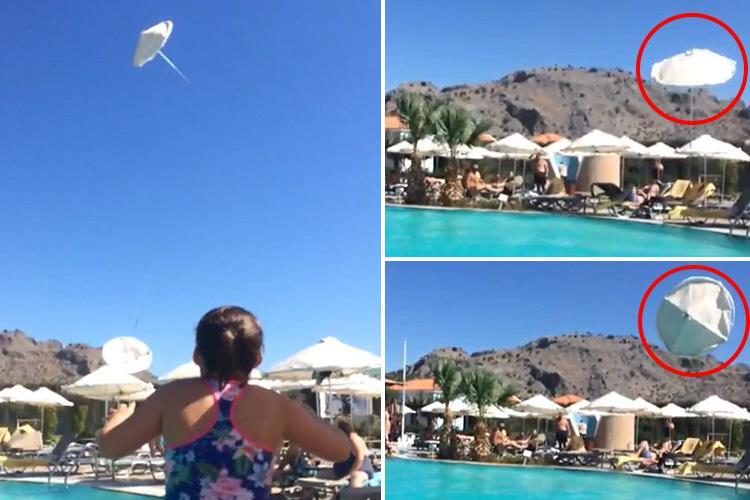 Parasols were sent hundreds of feet up into the air after a mini tornado hit a Greek holiday resort