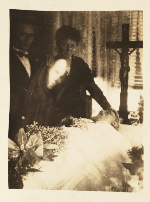 Ghost hovering over casket