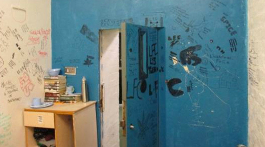 Cell covered in graffiti