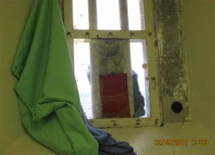 Broken window in a cell