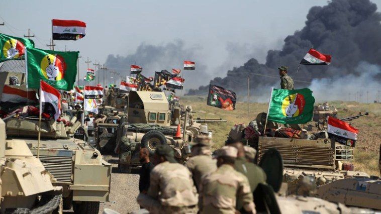 Click to enlarge Iraqi Shi'a fighters