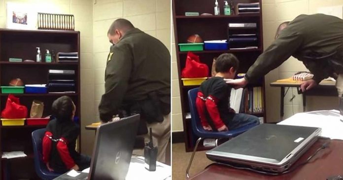 handcuffed boy