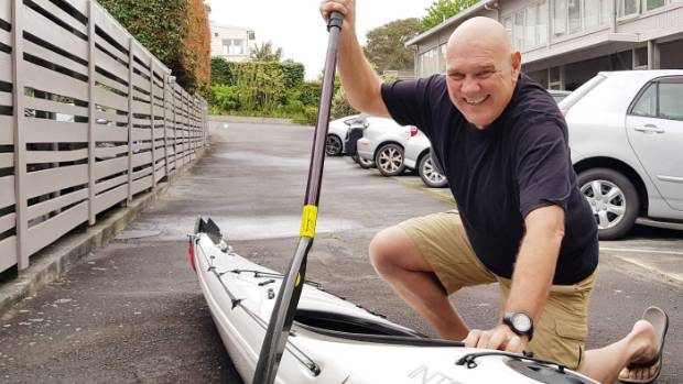 David Lomas demonstrating how he thumped a shark with his paddle after it attacked his kayak near Takapuna beach.