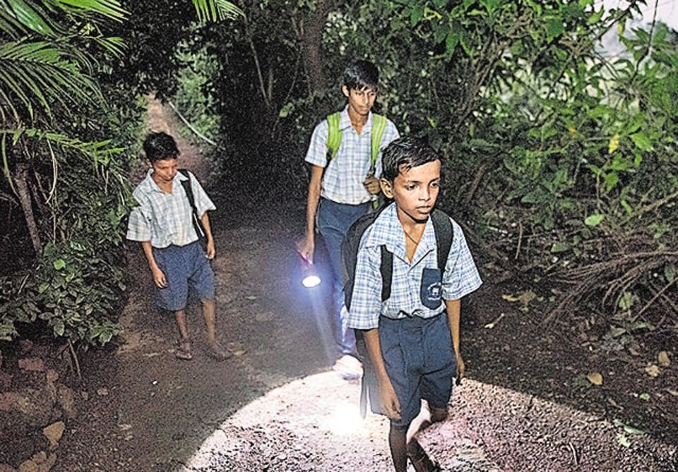 Children in the forest travel to school. They have been instructed to walk only in groups of six.