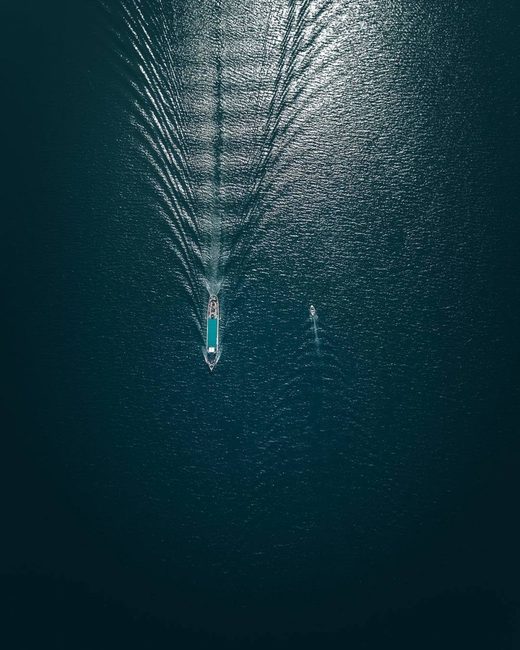 Click to enlarge Drone photographyLake, boat, waves, drone photography